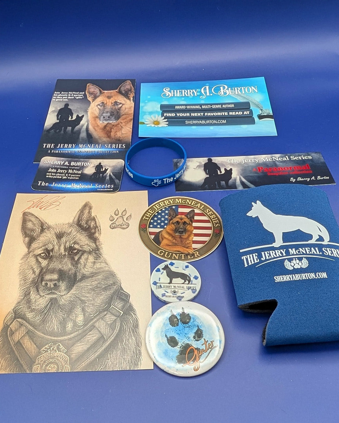 Collection of 'The Jerry McNeal Series' merchandise including a book, business card, can cooler, and coasters on a blue background.